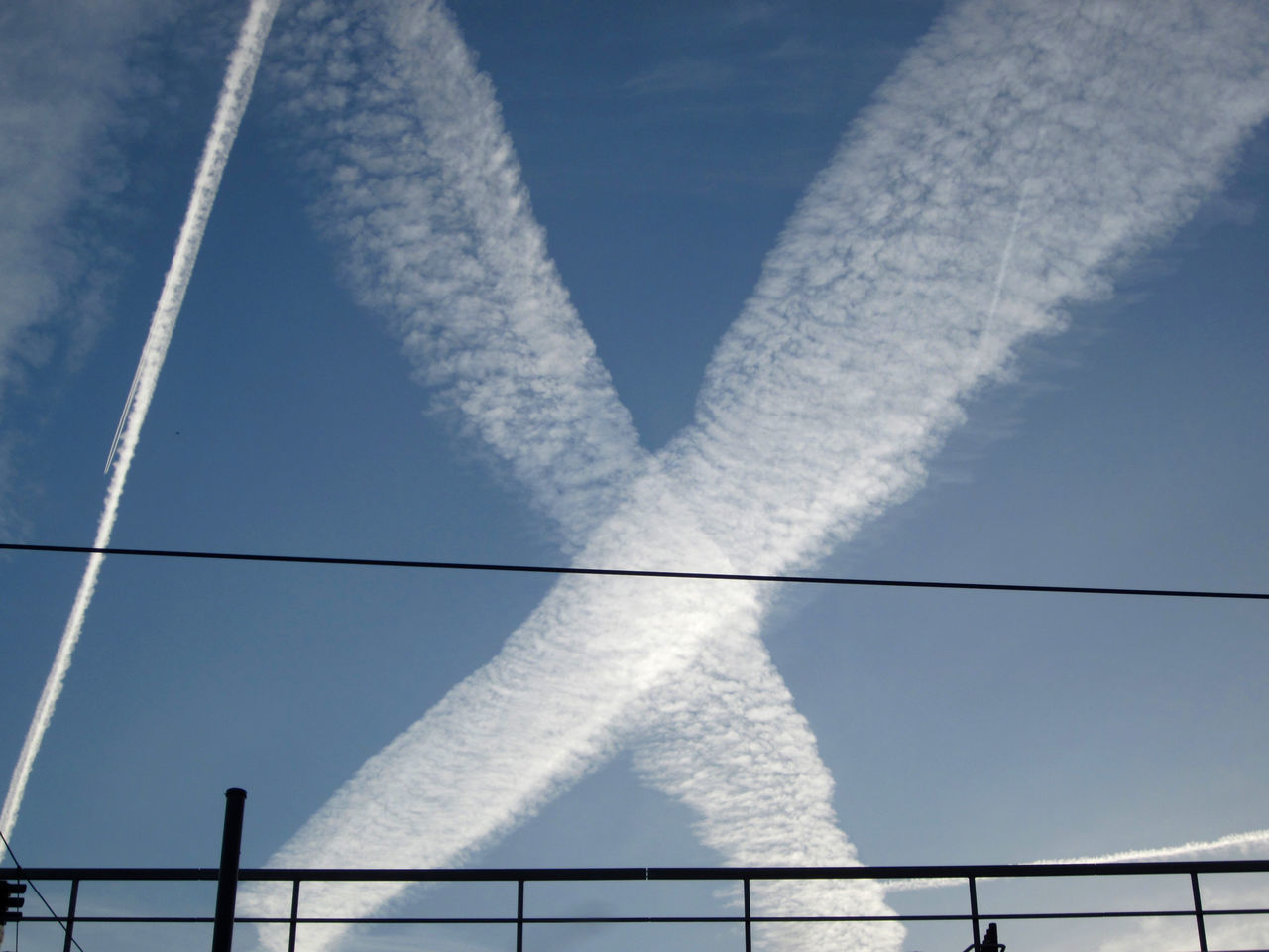 LOW ANGLE VIEW OF VAPOR TRAIL IN SKY