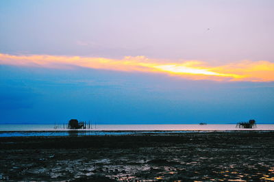 Scenic view of sea against sky at sunset