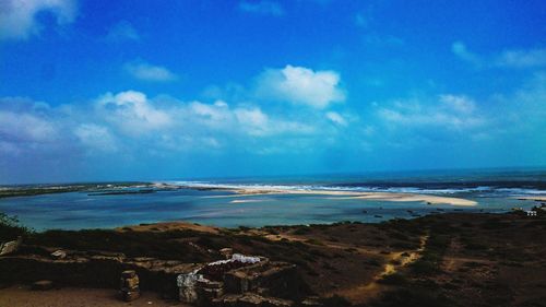 Scenic view of sea against blue sky