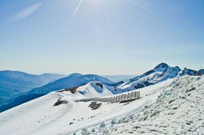 Scenic view of snowcapped mountains against clear sky