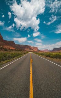 Empty road against sky