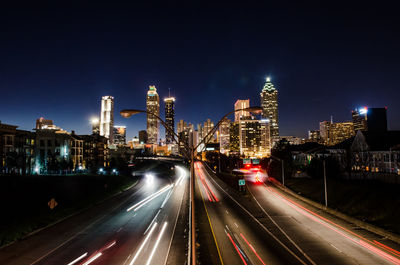 High angle view of light trails on road at night