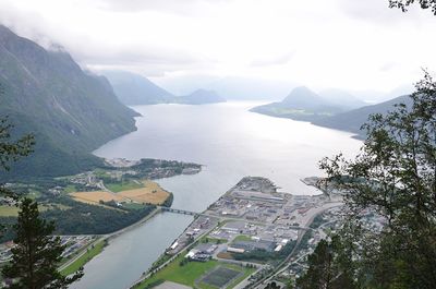 Scenic view of river and mountains in town