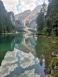 Scenic view of lake and mountains against sky