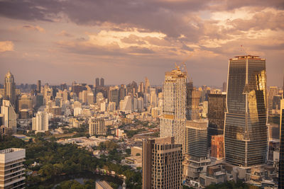 Aerial view of cityscape against sky during sunset