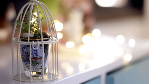 Close-up of illuminated glass table