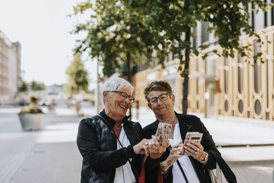 Senior women looking at cell phones