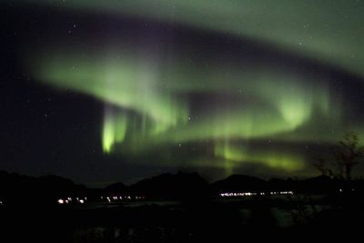 Scenic view of mountains against sky at night