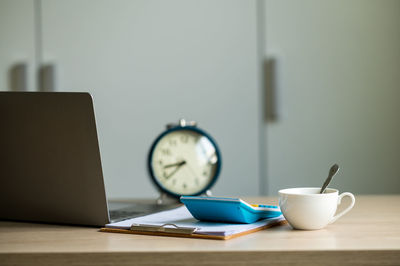 Close-up of coffee cup on table