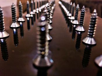 Close-up of screws on table