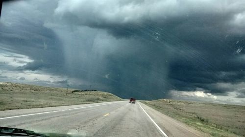 Road passing through dramatic landscape