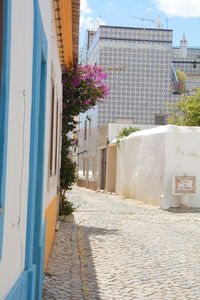 Alley amidst buildings in city