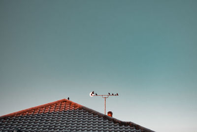 High section of building against clear sky