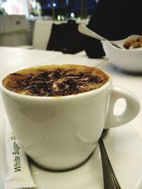Close-up of coffee cup on table