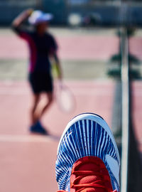 Close-up of shoes against blurred background