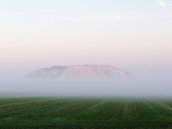 Scenic view of fog over land