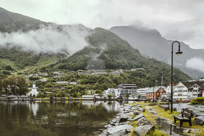 Scenic view of lake and mountains against sky