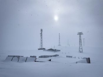 Transmission towers on a foggy winter day