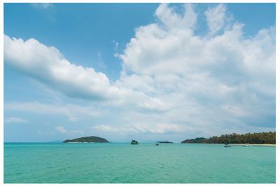 Scenic view of sea against cloudy sky