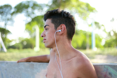 Side view of young man looking away