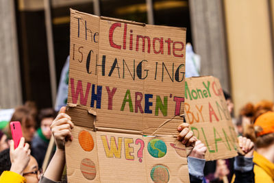 People holding text on paper