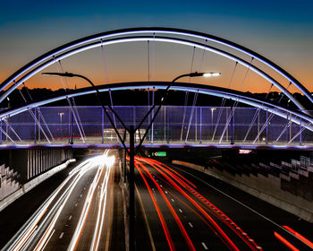 High angle view of light trails on road at night