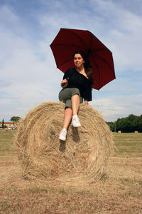 Full length of man wearing hat on field against sky