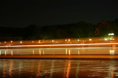 Illuminated ferris wheel at night
