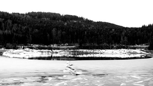 Scenic view of frozen lake against sky