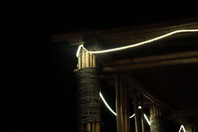 Low angle view of illuminated building against sky at night