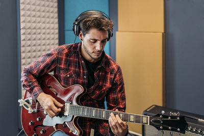 Young man playing guitar