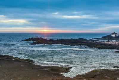 Scenic view of sea against sky during sunset