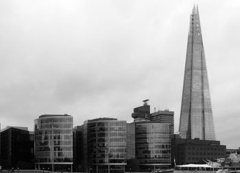 Low angle view of shard london bridge against sky in city