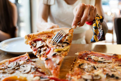 Midsection of pizza on table