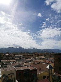 Aerial view of city against sky