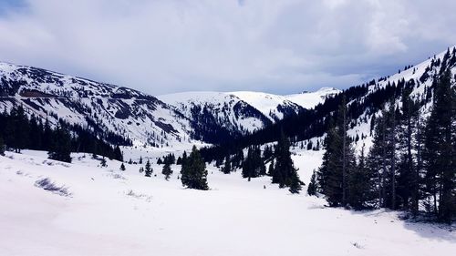 Scenic view of lake against sky during winter