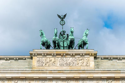 Low angle view of statue against sky