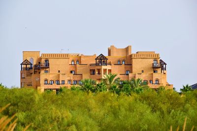 Low angle view of buildings against clear sky