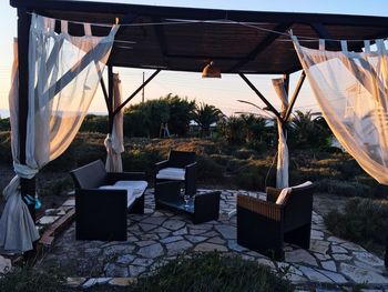 Chairs and tables on chair at beach