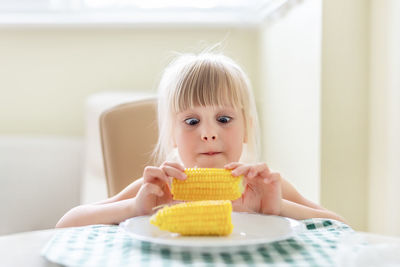 Portrait of a girl making face at home