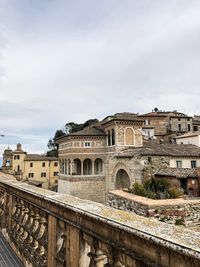 Arch bridge over buildings in city