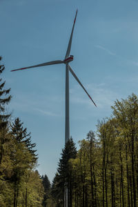 Low angle view of windmill against sky