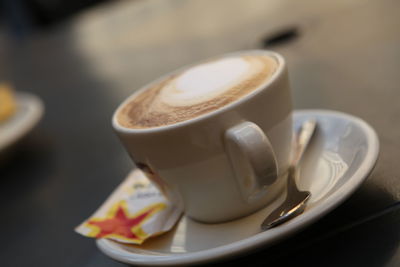 Close-up of cappuccino on table