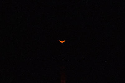 Low angle view of moon against sky at night