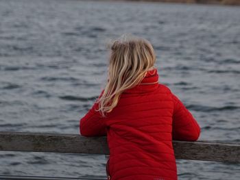 Rear view of girl looking at sea