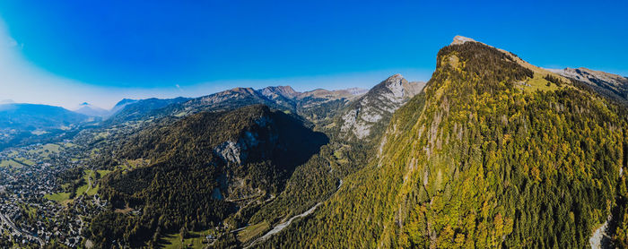 Scenic view of mountains against clear blue sky
