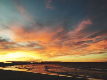 Scenic view of beach at sunset