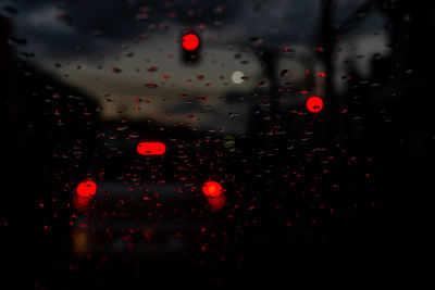 Close-up of wet glass window in rainy season