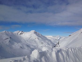 Scenic view of snowcapped mountains against sky