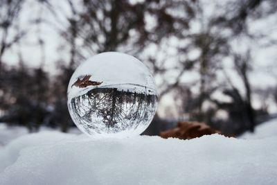 Close-up of crystal ball on snow
